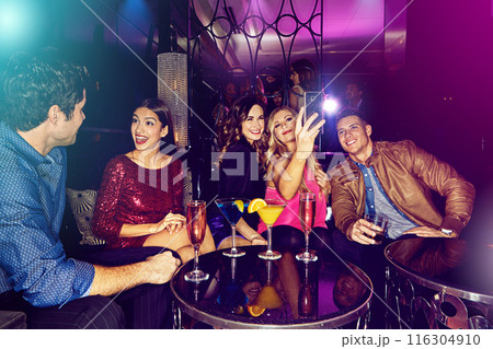People, selfie or friends in nightclub with cocktails, smile or drinks for memory, vip event or reunion. Pictures, men or happy women on dark party couch for alcohol, photograph or social celebration People, selfie or friends in nightclub with cocktails, smile or drinks for memory, vip event or reunion. Pictures, men or happy women on dark party couch for alcohol, photograph or social celebration 116304910