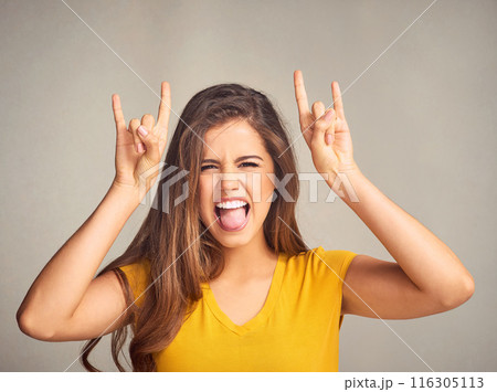 Woman, portrait and devil horns with hands in studio for grunge sign, tongue out or rock gesture on white background. Crazy, aesthetic and edgy female model for emoji, punk icon or rebel symbol 116305113