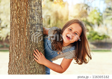 Park, girl and smile on tree on portrait for playing, fun or enjoy and child development. Outdoor, kid and happy person for summer vacation or school holiday with activity and routine in nature Park, girl and smile on tree on portrait for playing, fun or enjoy and child development. Outdoor, kid and happy person for summer vacation or school holiday with activity and routine in nature 116305182