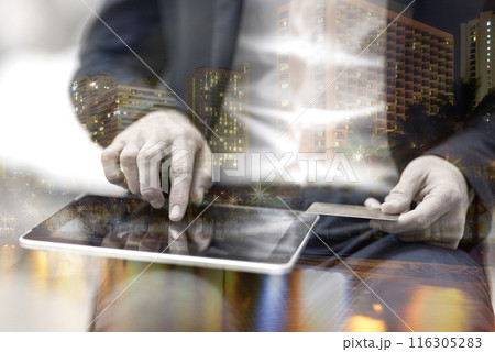 Credit card, hands and tablet in double exposure for online shopping, fintech or payment in global e commerce at night. Person, investor or trader typing on digital tech for banking in city overlay Credit card, hands and tablet in double exposure for online shopping, fintech or payment in global e commerce at night. Person, investor or trader typing on digital tech for banking in city overlay 116305283