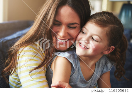 Smile, woman and child hug or love on sofa for trust, bonding and support of relationship moment. Happy, mother and girl as family for care, security or relax with embrace on couch for childhood 116305652