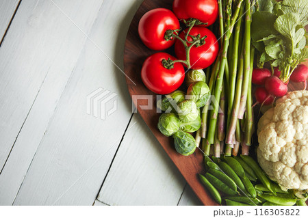 Home, table and veg on cutting board for cooking with diet, nutrition and healthy living. Fresh, food and kitchen counter with organic or vegetarian meal for wellness, wellbeing and self care Home, table and veg on cutting board for cooking with diet, nutrition and healthy living. Fresh, food and kitchen counter with organic or vegetarian meal for wellness, wellbeing and self care 116305822
