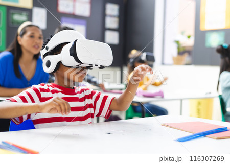 In school, in the classroom, a diverse group is exploring virtual reality, copy space In school, in the classroom, a diverse group is exploring virtual reality, copy space 116307269