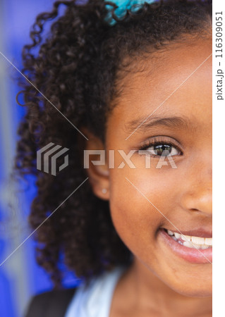 Close-up of a smiling biracial girl at school 116309051