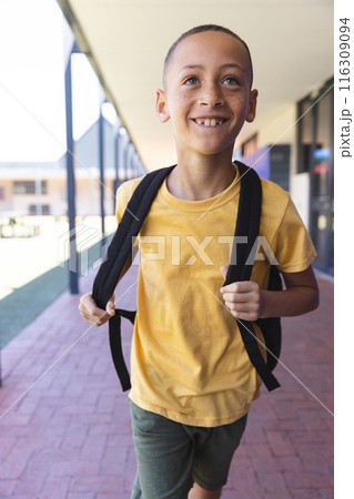 Biracial boy smiles at school 116309094