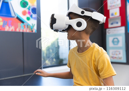 Biracial boy explores virtual reality at school 116309112