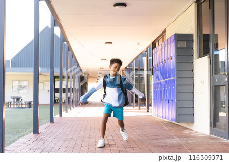Biracial boy enjoys a break at school, with copy space 116309371