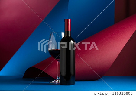 Bottle and glass of red wine. Bottle and glass of red wine. 116310800