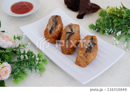 Spicy fried tofu filled with meat 116310849