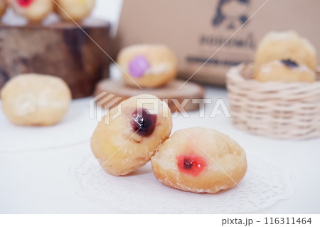 flavored ball donuts as a background flavored ball donuts as a background 116311464