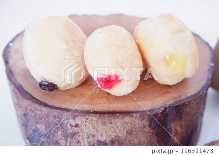 flavored ball donuts as a background flavored ball donuts as a background 116311473
