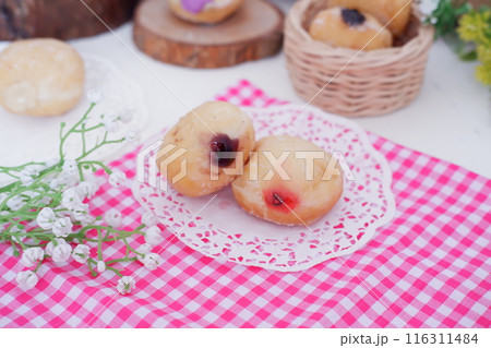 flavored ball donuts as a background flavored ball donuts as a background 116311484