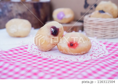 flavored ball donuts as a background flavored ball donuts as a background 116311504