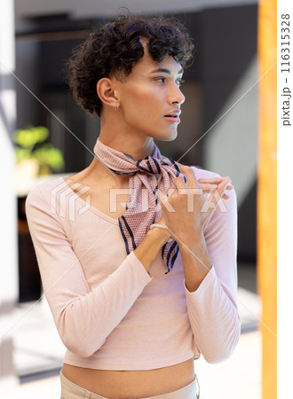 Posing confidently, transgender transgender woman wearing stylish scarf and light pink top 116315328