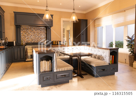 Modern kitchen with built-in dining nook and...の写真素材 [116315505] - PIXTA