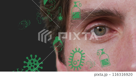 Multiple virus concept icons floating against close up of a caucasian man's eye Multiple virus concept icons floating against close up of a caucasian man's eye 116316920