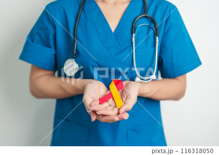 World hepatitis day awareness month, 28 July. Doctor holding Red and Yellow ribbon. Liver cancer, Jaundice, Cirrhosis, Failure, Enlarged, Hepatic Encephalopathy and Health concept World hepatitis day awareness month, 28 July. Doctor holding Red and Yellow ribbon. Liver cancer, Jaundice, Cirrhosis, Failure, Enlarged, Hepatic Encephalopathy and Health concept 116318050