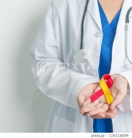 World hepatitis day awareness month, 28 July. Doctor holding Red and Yellow ribbon. Liver cancer, Jaundice, Cirrhosis, Failure, Enlarged, Hepatic Encephalopathy and Health concept 116318084