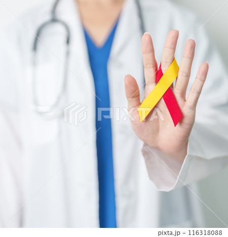 World hepatitis day awareness month, 28 July. Doctor holding Red and Yellow ribbon. Liver cancer, Jaundice, Cirrhosis, Failure, Enlarged, Hepatic Encephalopathy and Health concept 116318088