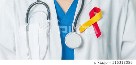 World hepatitis day awareness month, 28 July. Doctor holding Red and Yellow ribbon. Liver cancer, Jaundice, Cirrhosis, Failure, Enlarged, Hepatic Encephalopathy and Health concept 116318089