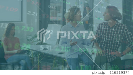 Image of graphs and trading board, diverse coworkers sitting on desk and discussing in office 116319374