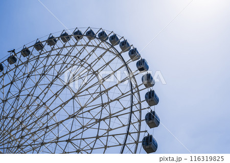 white big Ferris wheel on background a sky in amusement park 116319825