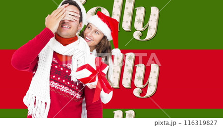 Image of jolly text on red and green stripes and happy couple with christmas hats and present Image of jolly text on red and green stripes and happy couple with christmas hats and present 116319827