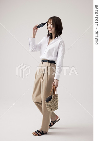 Korean Woman Poses Walking With Sunglasses 116320399