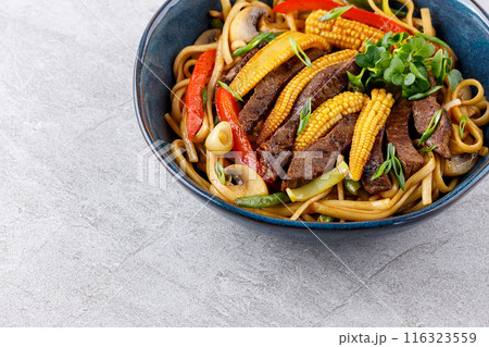 Udon noodles with beef and vegetables for the menu, website, restaurant or food delivery 116323559