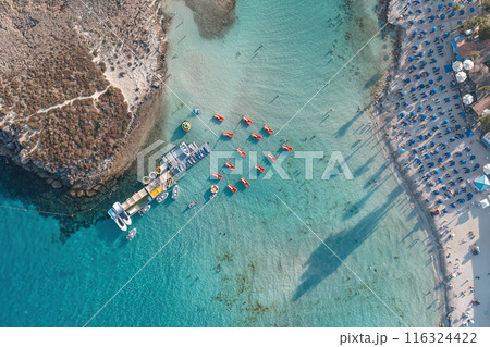 Aerial view of Nissi beach with tourists enjoying summer vacation. Ayia Napa, Cyprus Aerial view of Nissi beach with tourists enjoying summer vacation. Ayia Napa, Cyprus 116324422