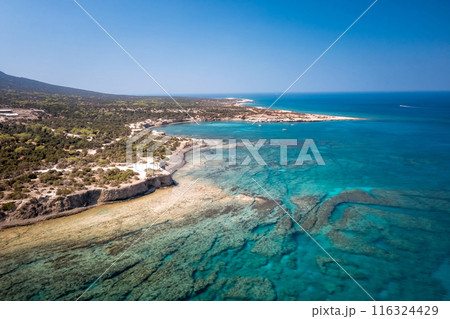 Turquoise water meeting green coastline. Blue Lagoon, Latchi, Paphos District, Cyprus 116324429
