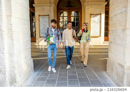 Students walking in university campus during break 116326604
