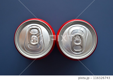 close up aluminium red cans soft drink put on blue texture background close up aluminium red cans soft drink put on blue texture background 116326743