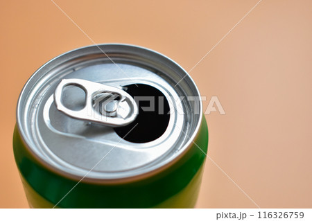 aluminum green drink cans on orange background, open cold fresh beverage aluminum green drink cans on orange background, open cold fresh beverage 116326759