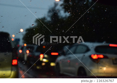 traffic jam on the road in night with rain, defocused background 116326767