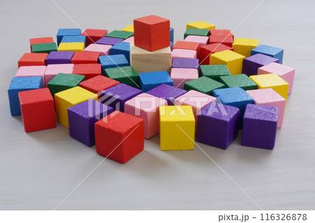 Inclusive leadership. A crowd of multi-colored cubes and one main one. Inclusive leadership. A crowd of multi-colored cubes and one main one. 116326878