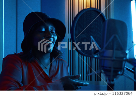 Musician Recording New Song In Studio 116327064