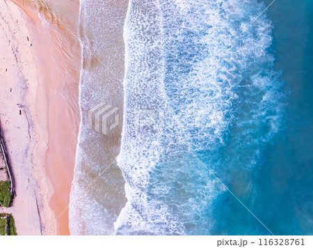 Aerial top view nature background of waves crashing in the ocean sea water, Drone view of sea waves in bird eye waves photo,Waves background Aerial top view nature background of waves crashing in the ocean sea water, Drone view of sea waves in bird eye waves photo,Waves background 116328761