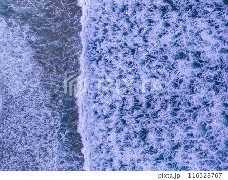 Aerial top view nature background of waves crashing in the ocean sea water, Drone view of sea waves in bird eye waves photo,Waves background 116328767