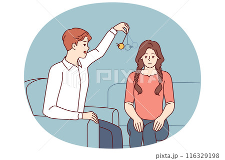 Man psychotherapist hypnotizes woman patient using pendulum to solve psychological problems Man psychotherapist hypnotizes woman patient using pendulum to solve psychological problems 116329198