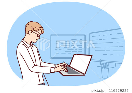 Man software developer is standing at table with laptop and monitors creating server applications 116329225