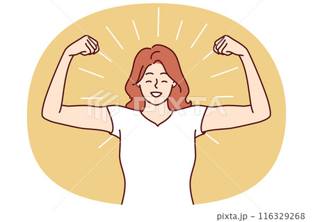Woman shows biceps and smiles standing in strongman pose to demonstrate self-confidence 116329268