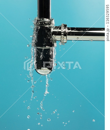 Water leak under sink on Nut Bolt stainless steel. Drain sink leak water from pipe plumbing in bathroom and repair by flume wrench tools as water splash drop. Blue background isolated 116329595