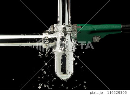Heavy Duty Wrench fix Water leak under sink. Drain sink leak water from pipe hose plumbing in bathroom and repair by wrench tools as water splash drop. Black background isolated Heavy Duty Wrench fix Water leak under sink. Drain sink leak water from pipe hose plumbing in bathroom and repair by wrench tools as water splash drop. Black background isolated 116329596
