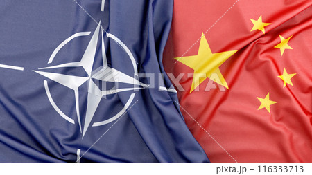 NATO flag lying next to Chinese flag representing international relations. 3D Rendering 116333713