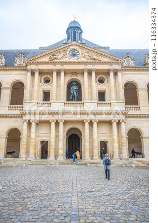The statue of Napoleon Bonaparte stands prominently at the niche of Les Invalides. Paris, France 116334374