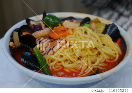 Jjambbong is a Korean-style Chinese noodle dish with seafood, meat, and vegetables 116335293