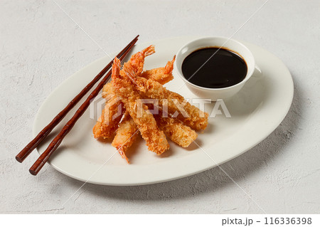 Fried shrimp, peeled in tempura, soy sauce, close-up, 116336398