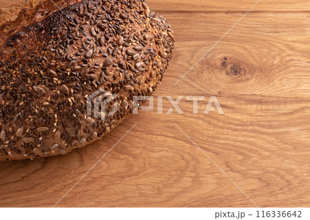 fresh homemade bread on wooden background, side view fresh homemade bread on wooden background, side view 116336642