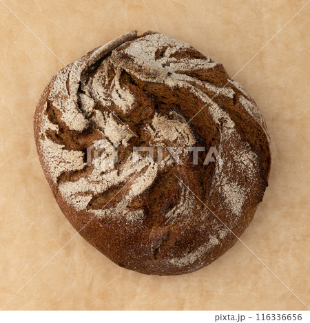 fresh rye bread on parchment for baking, top view fresh rye bread on parchment for baking, top view 116336656